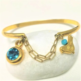 Bracelet jonc plaqué or 24 carats avec cabochon cristal bleu et breloque oiseau